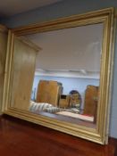 A gilt framed overmantel mirror