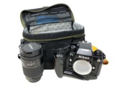 A Nikon F4 camera body numbered 2244123, in carry bag together with a Nikon AF Nikkor 35-135mm lens,