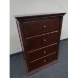 A shoe cabinet in the form of a four drawer chest