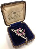 A fine quality 18ct white gold diamond and ruby set Hong Kong Jockey Club brooch, length 5cm.