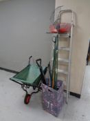 A folding aluminium stepladder together with a folding barrow and a quantity of garden tools