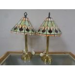 A pair of brass column table lamps with leaded glass shades