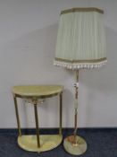 A brass and onyx two tier demi lune table together with a similar standard lamp with shade