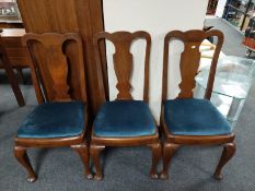 A set of three walnut Queen Anne style dining chairs
