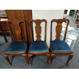 A set of three walnut Queen Anne style dining chairs