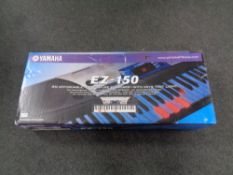 A Yamaha EZ-150 electric keyboard