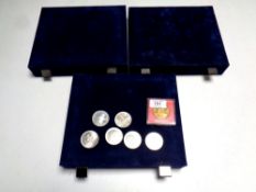 Three Royal Mint Coin Collector's cases together with six assorted crowns and a Winston Churchill