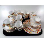 A tray containing forty-two pieces of Duchess Honesty bone tea china