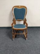An upholstered beech rocking chair