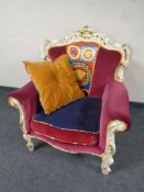 A French style cream and gilt armchair in Versace upholstery