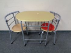 A contemporary oval kitchen table with two stowaway chairs