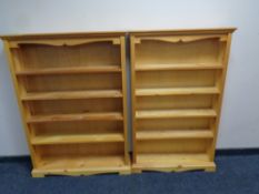 Two sets of pine open bookshelves