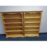 Two sets of pine open bookshelves