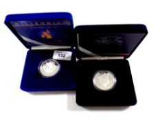 Two Royal Mint silver proof five pound coins, Queen Mother's Centenary Year and The Millennium coin,