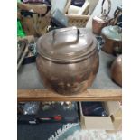 A 19th century swing handled copper cooking pot with lid