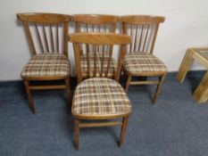 A set of four mid 20th century spindle back kitchen chairs