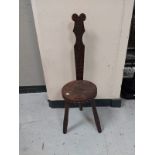 A carved spinning stool