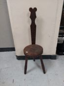 A carved spinning stool