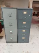 A Bisley metal four drawer filing cabinet together with one other similar cabinet with keys