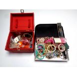 A tray containing a red faux leather jewellery box containing a large quantity of costume jewellery