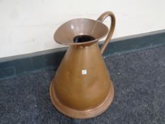 An antique copper gallon jug