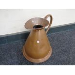 An antique copper gallon jug
