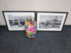A glass jar containing a large quantity of coloured ping pong balls (as found) together with two