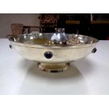 A silver plated ecclesiastical style bowl containing six assorted novelty pocket and table lighters