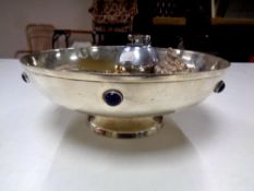 A silver plated ecclesiastical style bowl containing six assorted novelty pocket and table lighters