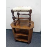 A 20th century oak octagonal three tier book table together with a beech wood tapestry upholstered