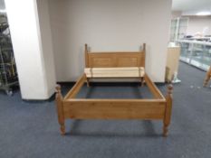 A contemporary pine 5 ft bed frame with mattress slats