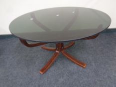 A 20th century Scandinavian pedestal coffee table with a smoked glass top
