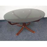 A 20th century Scandinavian pedestal coffee table with a smoked glass top