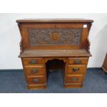 A 19th century carved oak Arts and Crafts secretaire desk, height 118 cm,