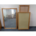 A large pine framed mirror together with two pine framed notice boards and a further pine frame