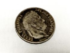 An 1857 silver five franc coin