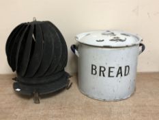 A vintage enamelled bread bin together with a chimney cowl