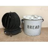 A vintage enamelled bread bin together with a chimney cowl