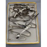 A collection of silver plated sugar tongs