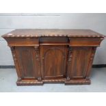 A 19th century rosewood triple door break front chiffonier base,