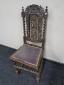A 19th century heavily carved oak barley twist hall chair