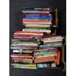 Two boxes containing hardback and paperback volumes relating to railways and steam trains