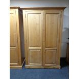 A pine double door wardrobe,