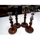 Two pairs of Edwardian barley twist candlesticks