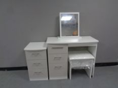 A contemporary white single pedestal knee hole dressing table with mirror and stool and matching