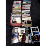 Two boxes containing seven inch singles, Elton John,