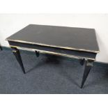 A French style painted coffee table on tapered legs,