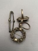 Two silver marcasite rings together with two silver brooches CONDITION REPORT: 26g