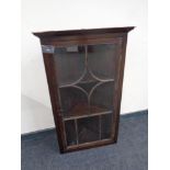 A 19th century glazed hanging corner cabinet