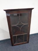 A 19th century glazed hanging corner cabinet